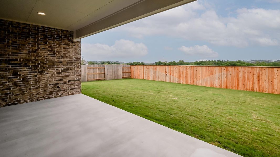 View of yard with a patio area