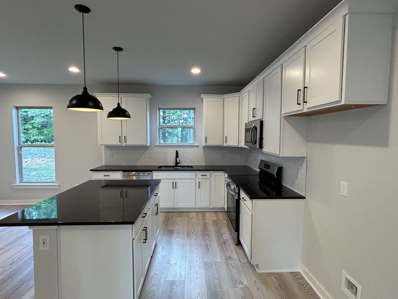 Furnished interior view inside a new home in Hickory Cove, Burns (Image 7).