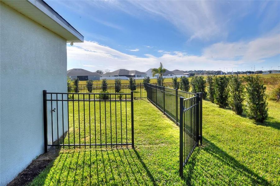 Gate to outdoor fenced in area.