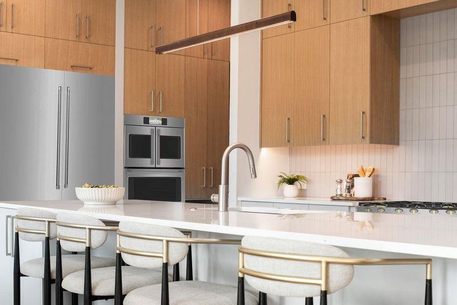 Custom cabinetry and a GE Profile appliance package deliver both performance and elevated design.