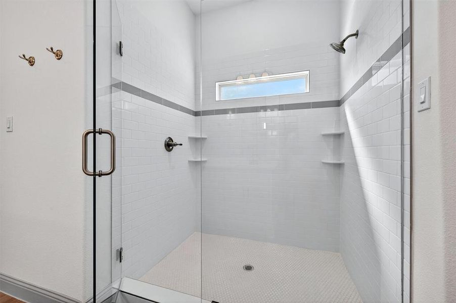 Bathroom featuring a shower stall