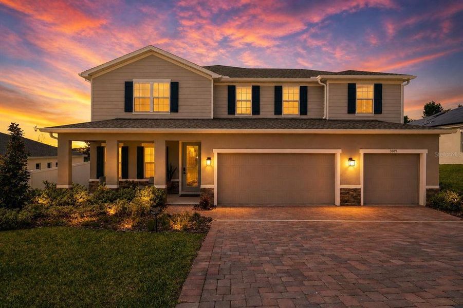 Front exterior of a new home in Bella Terra, Clermont, FL, highlighting curb appeal (Image 22).