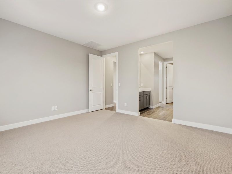 Spacious, unfurnished interior of a new home in Blossom Rock Reserve Series, Apache Junction (Image 9).