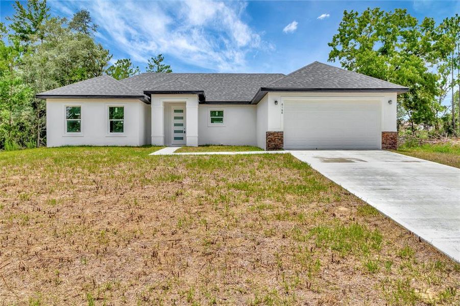 Front exterior of a new home in , Ocala, FL, highlighting curb appeal (Image 18).