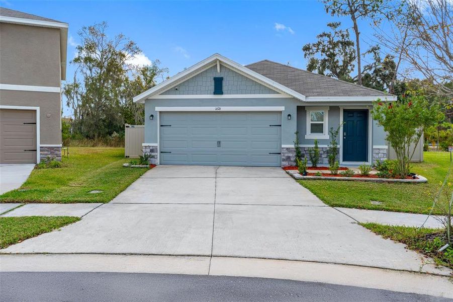 Front exterior of a new home in North Park Isle, Plant City, FL, highlighting curb appeal (Image 1). Front exterior of a new home in North Park Isle, Plant City, FL, highlighting curb appeal (Image 1).
