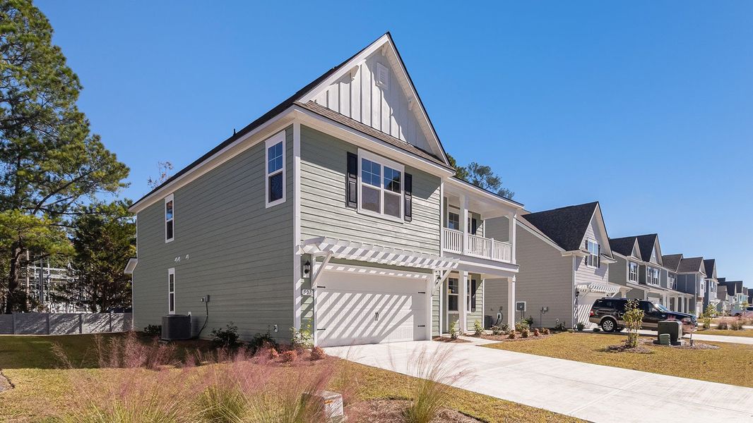Front exterior of a new home in Eden Springs, Longs, SC, highlighting curb appeal (Image 21).
