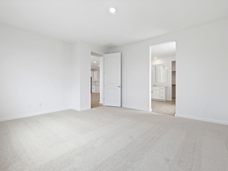 Spacious, unfurnished interior of a new home in White Tank Foothills Signature Series, Waddell (Image 12).