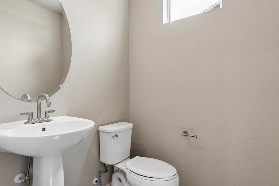 A bathroom with a sink and toilet.