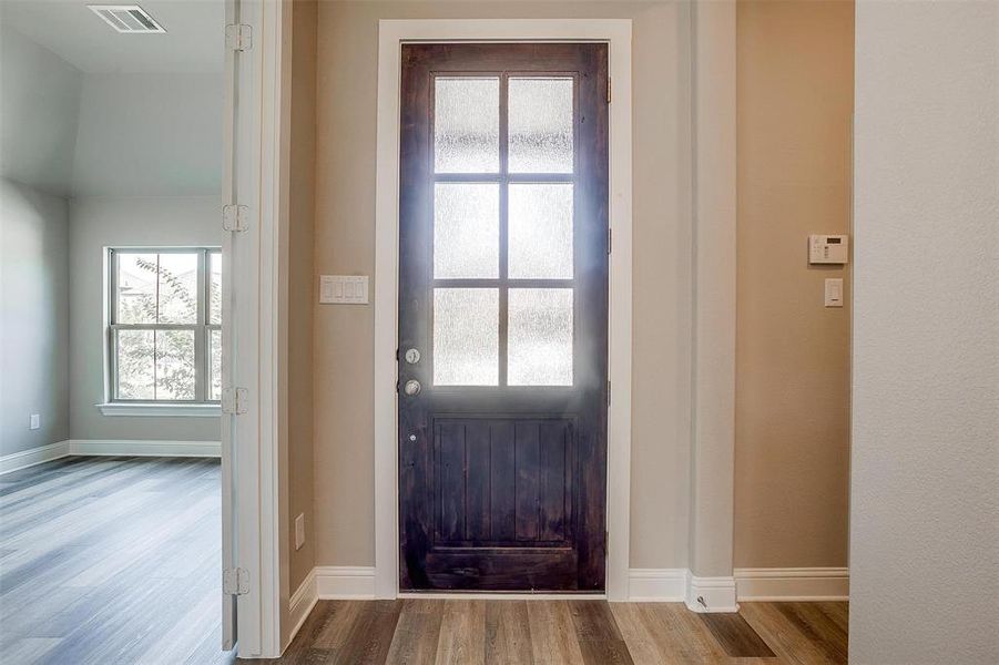 Doorway to outside featuring hardwood / wood-style flooring