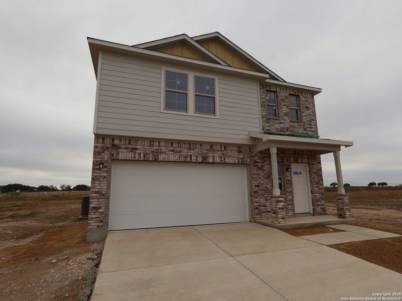 Front exterior of a new home in Winding Brook, San Antonio, TX, highlighting curb appeal (Image 1). Front exterior of a new home in Winding Brook, San Antonio, TX, highlighting curb appeal (Image 1).