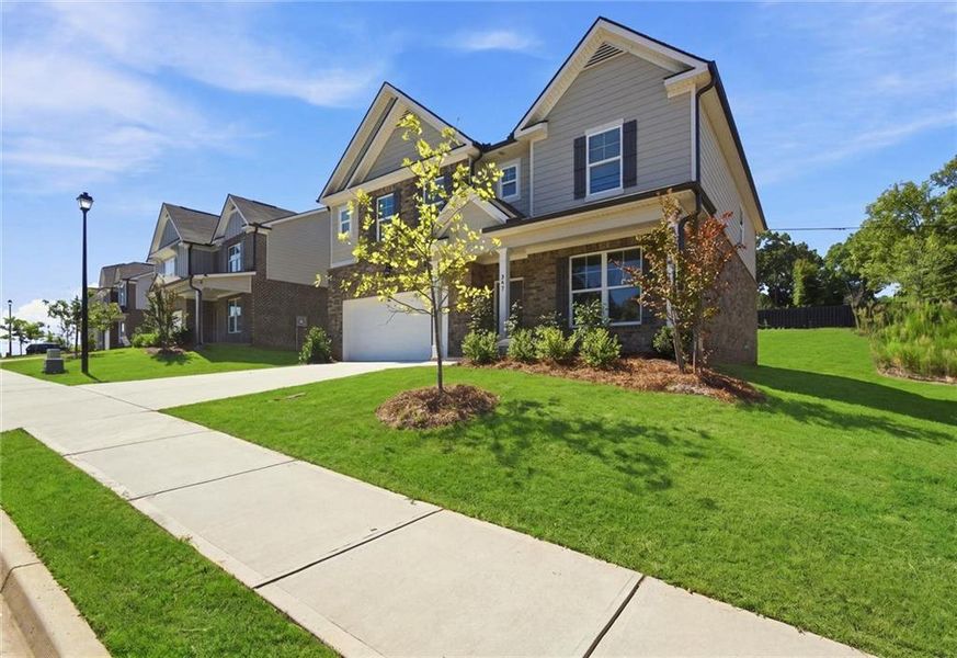 Front exterior of a new home in , Lawrenceville, GA, highlighting curb appeal (Image 23). Front exterior of a new home in , Lawrenceville, GA, highlighting curb appeal (Image 23).