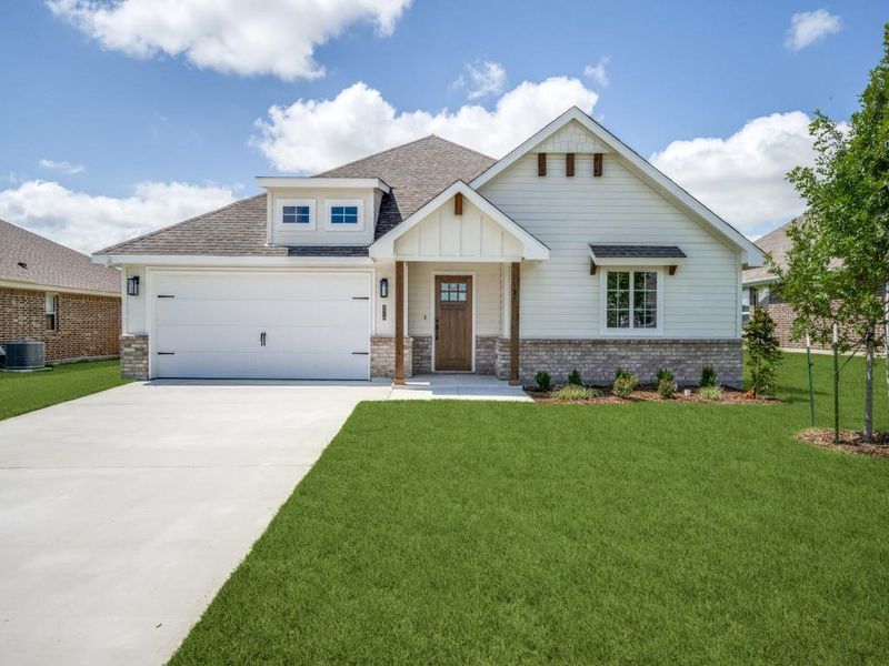 Front exterior of a new home in , Sanger, TX, highlighting curb appeal (Image 15).