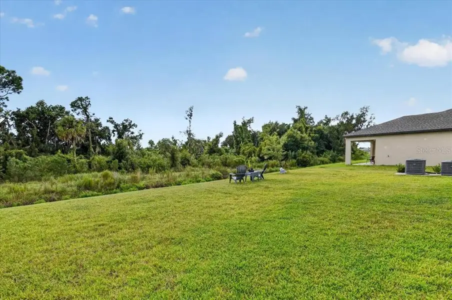 Exterior details and patio area of a home in Prosperity Lakes, Parrish (Image 4).
