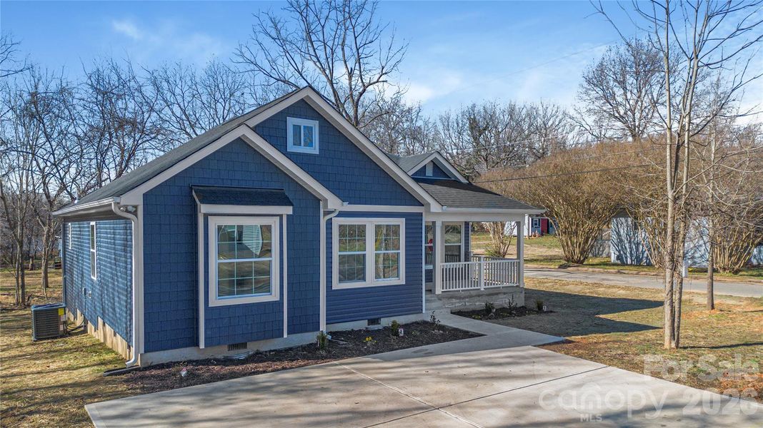 Front exterior of a new home in , East Spencer, NC, highlighting curb appeal (Image 17).