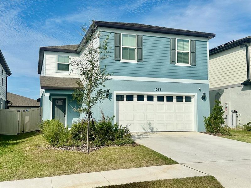 Front exterior of a new home in Silverlake, Lake Alfred, FL, highlighting curb appeal (Image 17). Front exterior of a new home in Silverlake, Lake Alfred, FL, highlighting curb appeal (Image 17).
