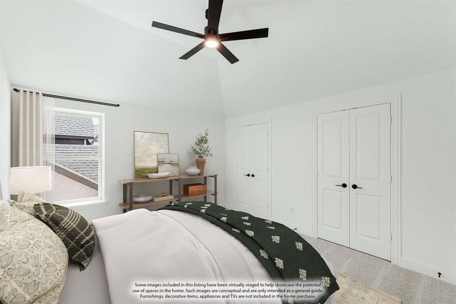 Bedroom with vaulted ceiling, ceiling fan, double closet doors, and carpet flooring