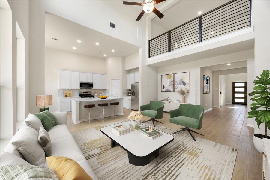 Embrace the epitome of modern living in this seamless, open-concept floor plan. The design effortlessly integrates the spacious kitchen, dining, and living areas, all connected by continuous light wide-plank flooring and dramatic soaring ceiling. *Virtually Staged Embrace the epitome of modern living in this seamless, open-concept floor plan. The design effortlessly integrates the spacious kitchen, dining, and living areas, all connected by continuous light wide-plank flooring and dramatic soaring ceiling. *Virtually Staged