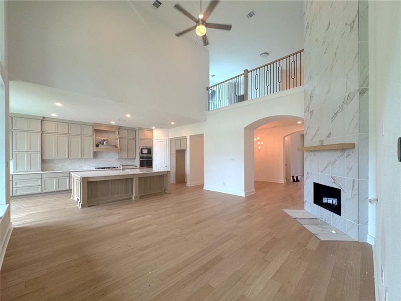 Upgraded fireplace with tile going all the way up to the ceiling