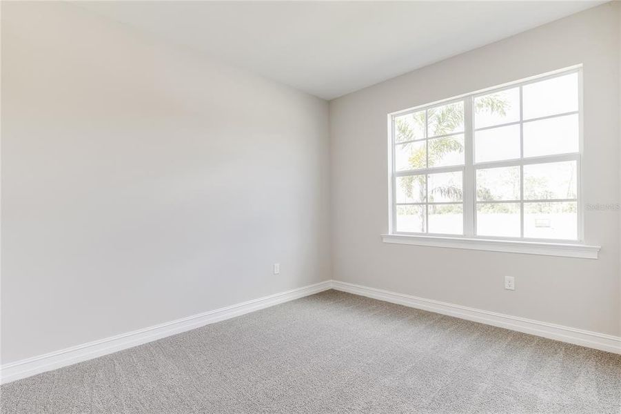 Spacious, unfurnished interior of a new home in Coral Lakes - Tradition & Express, Punta Gorda (Image 12).