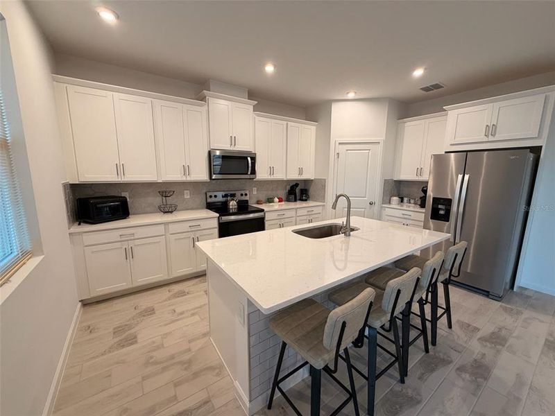Furnished interior view inside a new home in Waterbrooke, Clermont (Image 10).