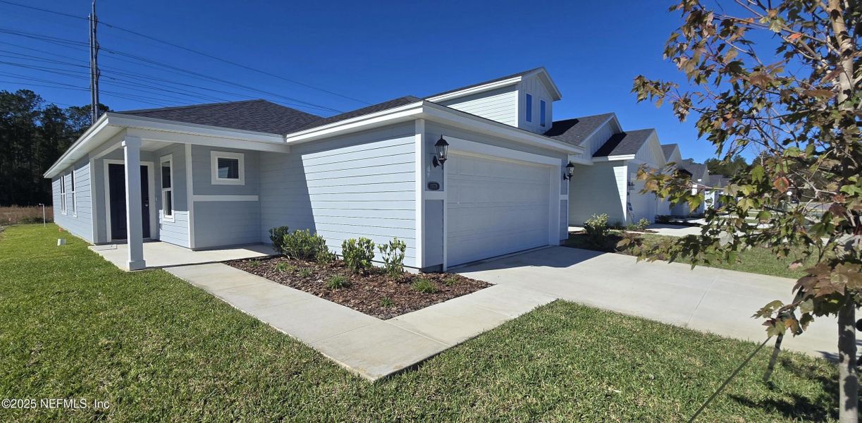 Front exterior of a new home in Kings Preserve, Jacksonville, FL, highlighting curb appeal (Image 2). Front exterior of a new home in Kings Preserve, Jacksonville, FL, highlighting curb appeal (Image 2).