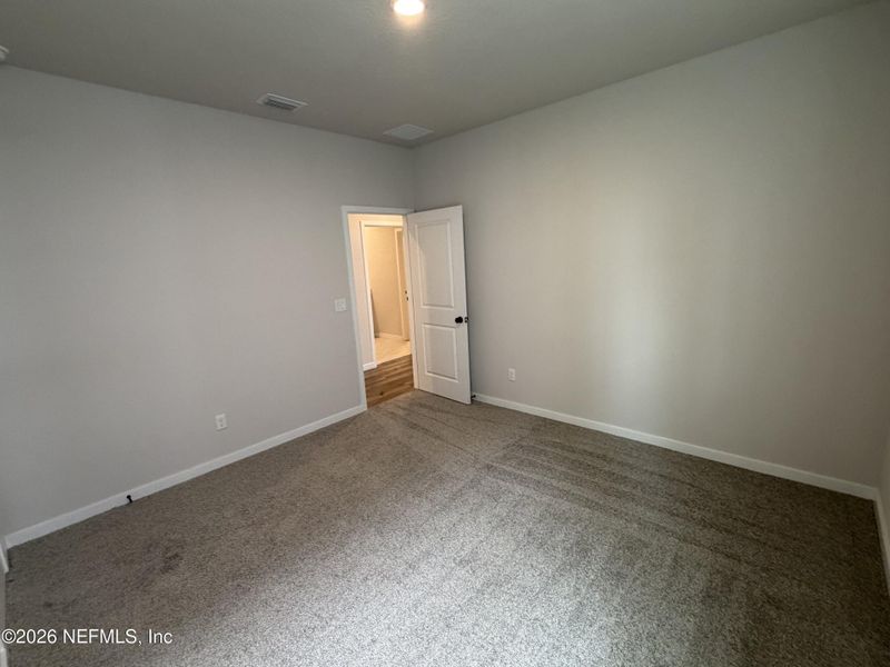 Spacious, unfurnished interior of a new home in Reserve East, Flagler Beach (Image 24).