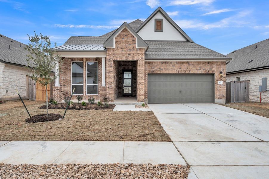 Front exterior of a new home in Crescent Bluff, Georgetown, TX, highlighting curb appeal (Image 2). Front exterior of a new home in Crescent Bluff, Georgetown, TX, highlighting curb appeal (Image 2).