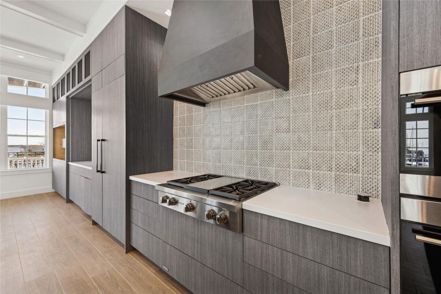 2443 is decked out with high-end appliances and smart technology that make it easy to come and go and the space - and leave it! Beautiful kitchen with Wolf appliances and plenty of storage.  Enjoy expansive views of Clear Lake while cooking and entertaining guests on the front patio.
