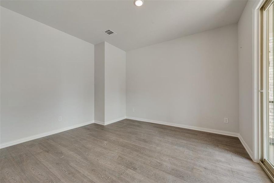 Empty room featuring hardwood / wood-style floors