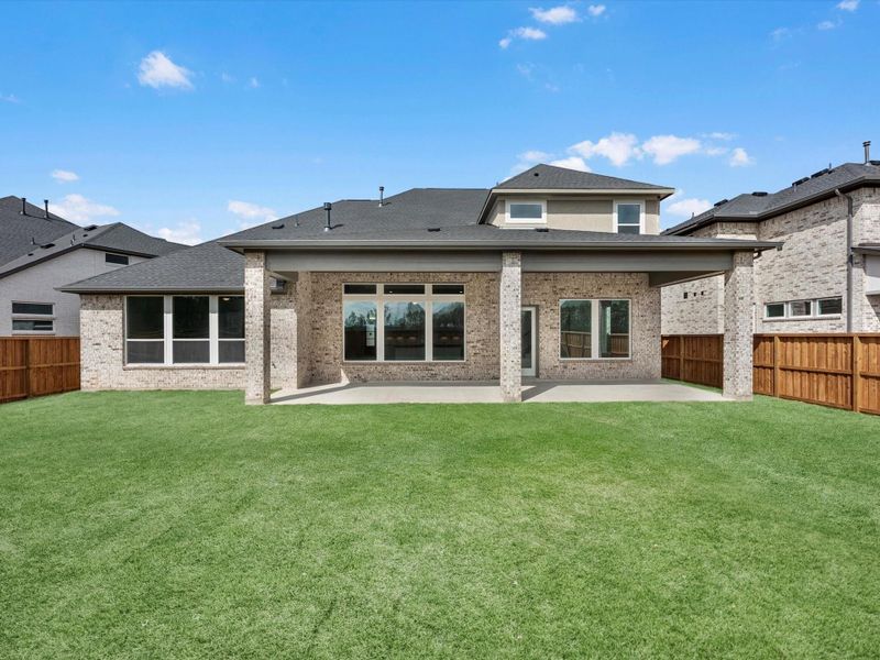 Exterior details and patio area of a home in Woodson’s Reserve, Spring (Image 4).