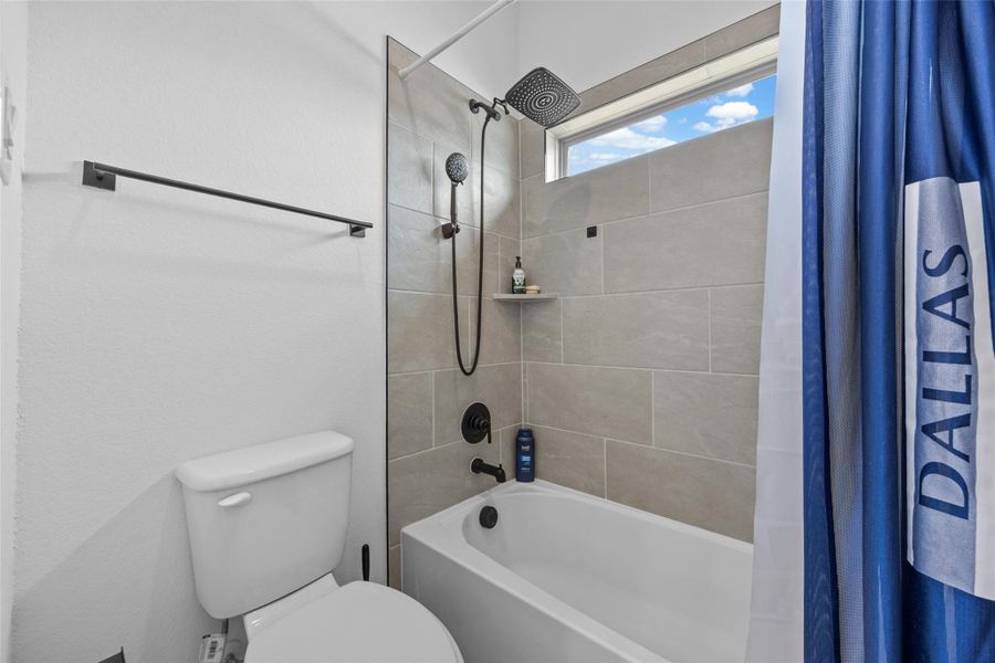 Tiled shower with a dual showerhead and an integrated shelf. Tiled shower with a dual showerhead and an integrated shelf.