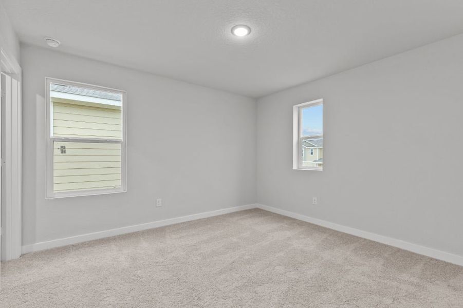 A room with a window and a carpet. A room with a window and a carpet.