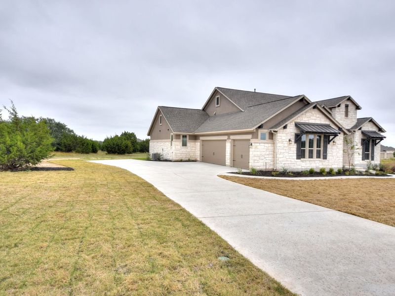 Representative exterior photo of a completed home built from the San Simeon I by Giddens Homes in Clearwater Ranch, Liberty Hill, TX (Image 46).