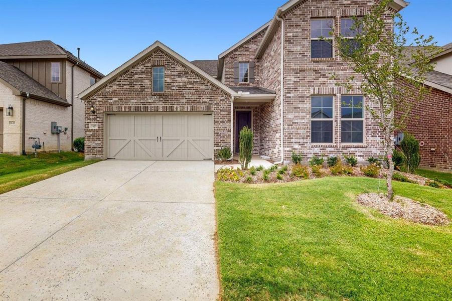Front exterior of a new home in Lilybrooke at Legacy Hills, Celina, TX, highlighting curb appeal (Image 16).