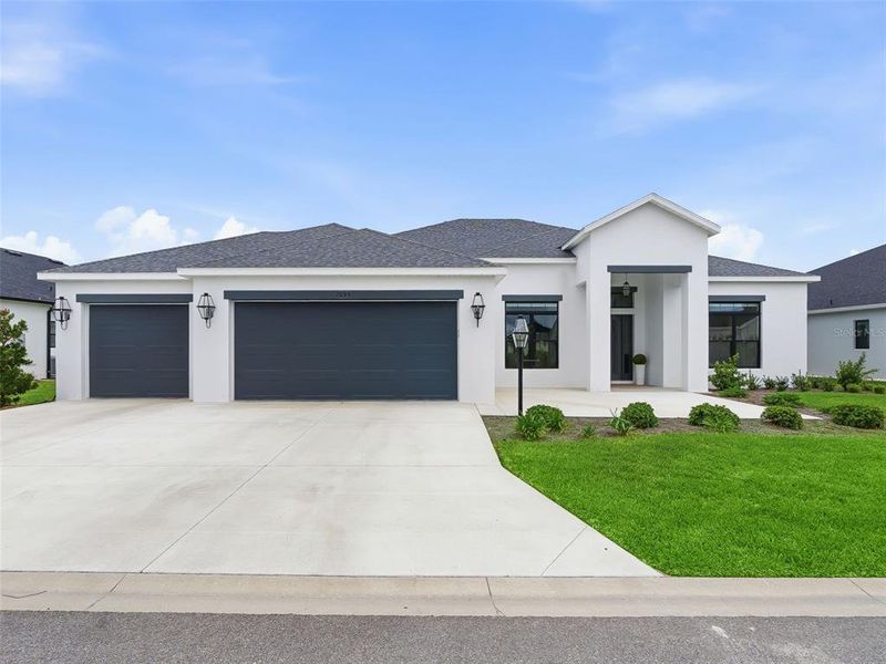 Front exterior of a new home in , The Villages, FL, highlighting curb appeal (Image 26). Front exterior of a new home in , The Villages, FL, highlighting curb appeal (Image 26).