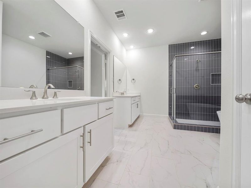 Dual vanities and elegant quartz countertops in the Primary Bath provide the perfect balance of beauty and function for beginning and ending your day.