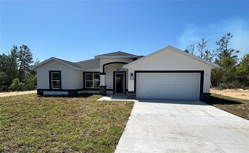 Front exterior of a new home in , Dunnellon, FL, highlighting curb appeal (Image 2). Front exterior of a new home in , Dunnellon, FL, highlighting curb appeal (Image 2).