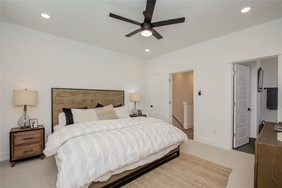 Spacious and elegant primary bedroom! Photos from another community by the same builder, FINISHES & FLOOR PLAN MAY VARY! Ceiling fans are not included!