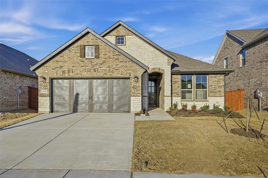 Front exterior of a new home in Morningstar, Aledo, TX, highlighting curb appeal (Image 21).