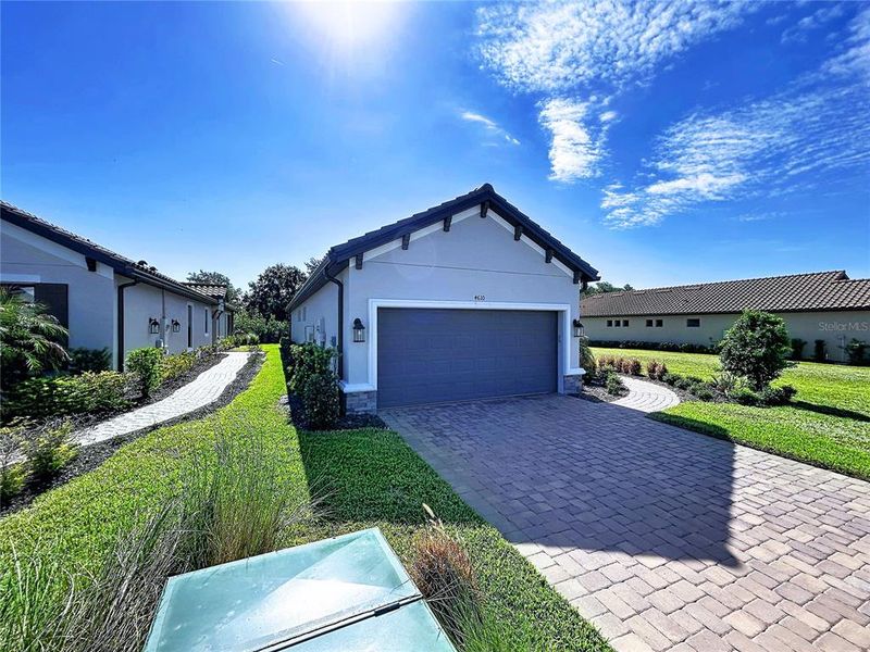 Front exterior of a new home in , Wesley Chapel, FL, highlighting curb appeal (Image 27).