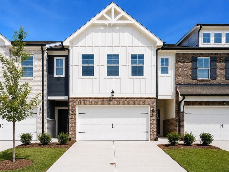 Front exterior of a new home in Union Village, McDonough, GA, highlighting curb appeal (Image 23).