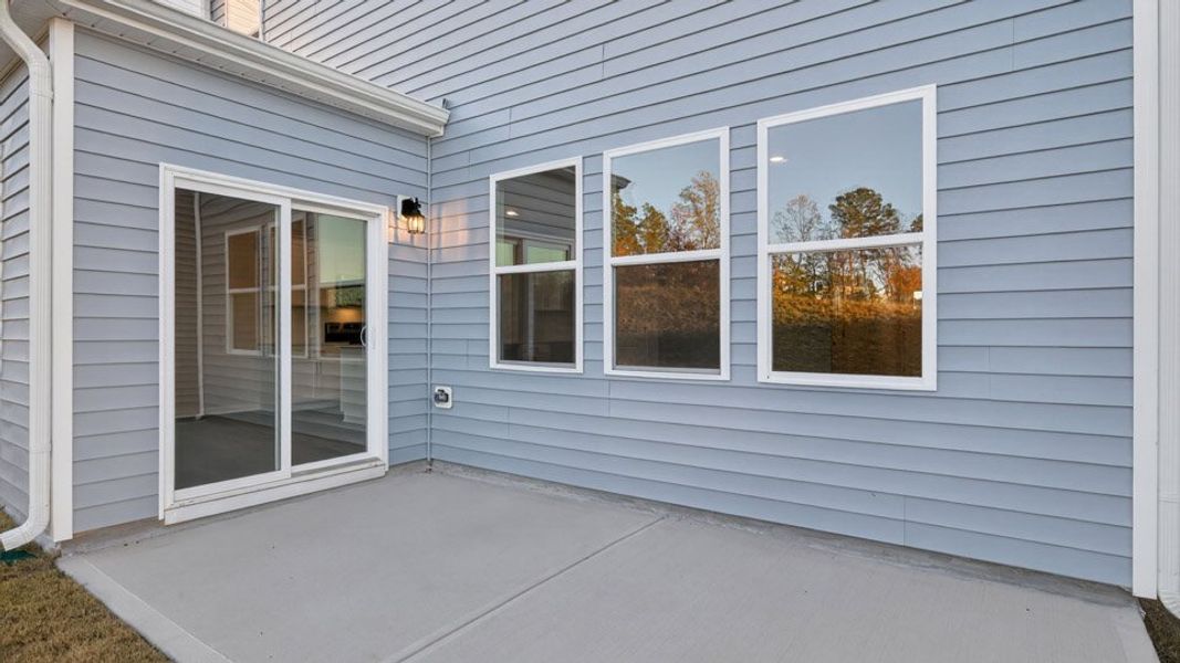 Exterior details and patio area of a home in The Grove at Matthews Landing, Fuquay Varina (Image 3).