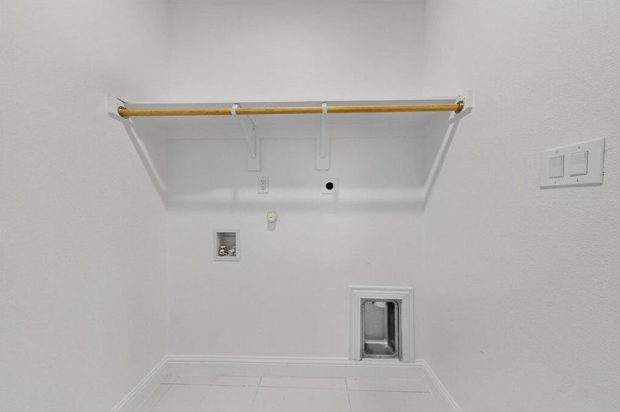 Laundry room with gas dryer hookup, light tile patterned floors, washer hookup, and electric dryer hookup