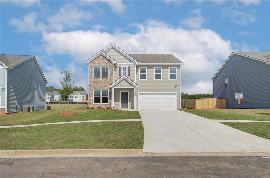 Front exterior of a new home in Chapel Hill, Newnan, GA, highlighting curb appeal (Image 1). Front exterior of a new home in Chapel Hill, Newnan, GA, highlighting curb appeal (Image 1).