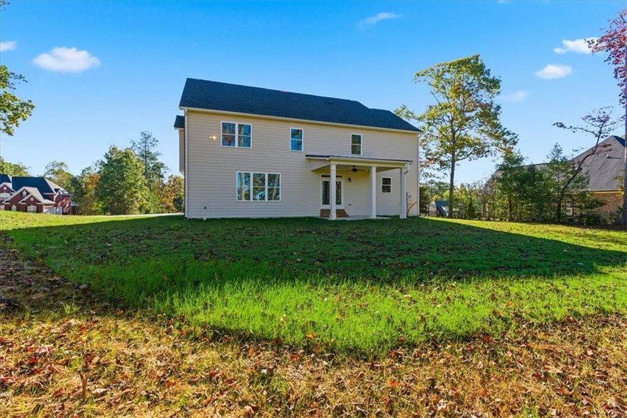Exterior details and patio area of a home in The Estates at Hurricane Pointe, Douglasville (Image 29).