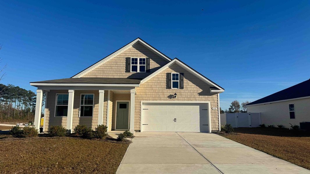 Front exterior of a new home in Preserve at Cypress Commons, Conway, SC, highlighting curb appeal (Image 1).