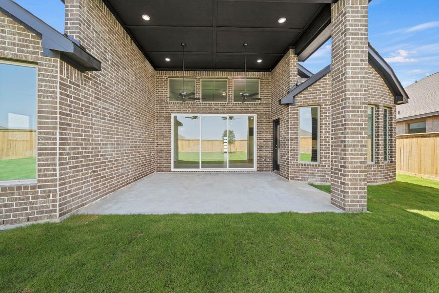 Exterior details and patio area of a home in Bridgeland, Cypress (Image 4).