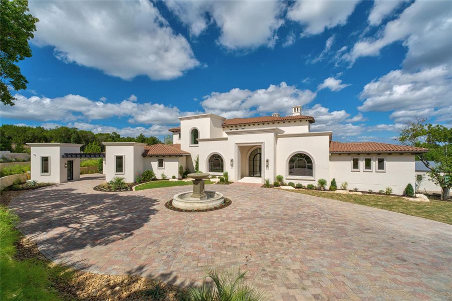 Santa Barbara classic exterior of stucco, clay tile roof and stone fountain