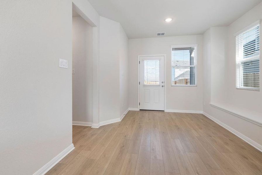 Entryway with hardwood / wood-style flooring and recessed lighting