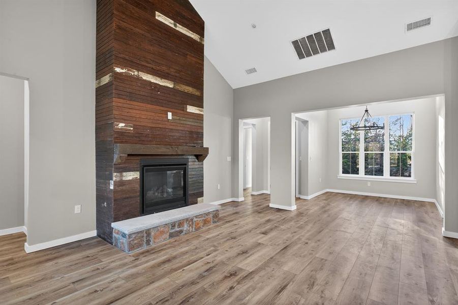 Antique beadboard fireplace is a stunning showpiece in this open living space!